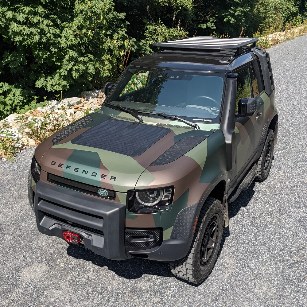 Cascadia 4x4 hood solar panel system for the new land rover defender, wrapped in camo