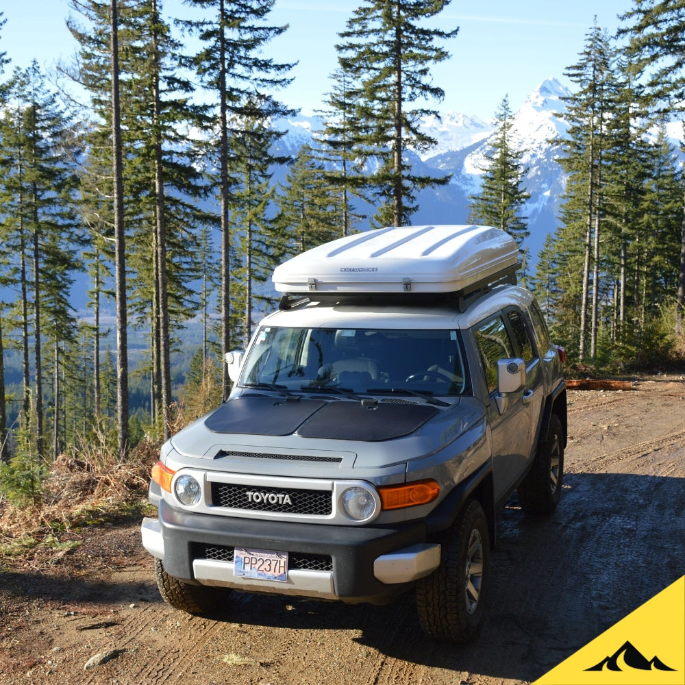 Toyota FJ Cruiser with Cascadia 4x4 hood solar panel for overlanding. Autohome Roof Top Tent. 