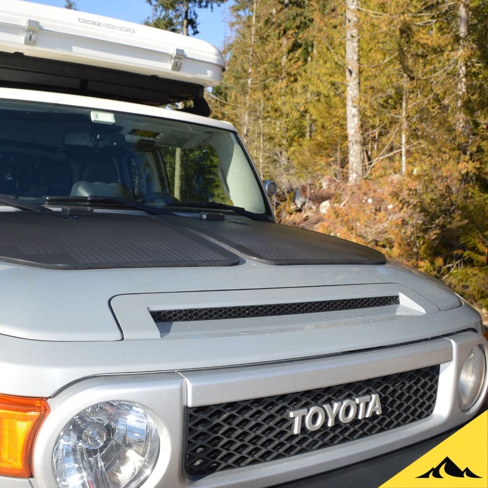 Toyota FJ Cruiser with Cascadia 4x4 hood solar panel for keeping battery trickle charge. 